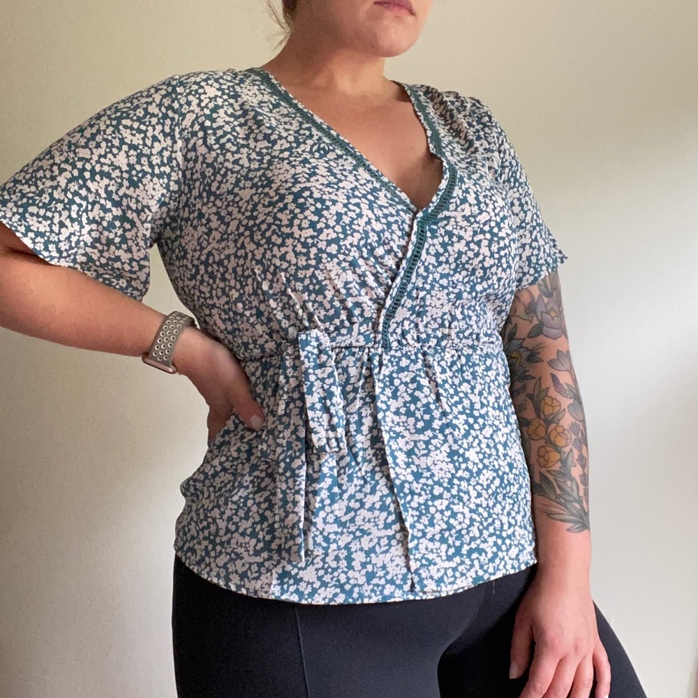 Medium blue floral wrap top
